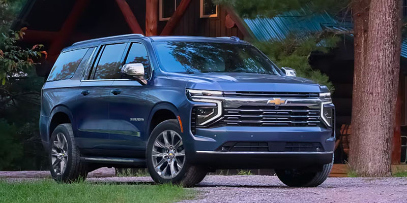 A blue 2025 Chevrolet Suburban available at Moran Chevrolet Clinton Township.