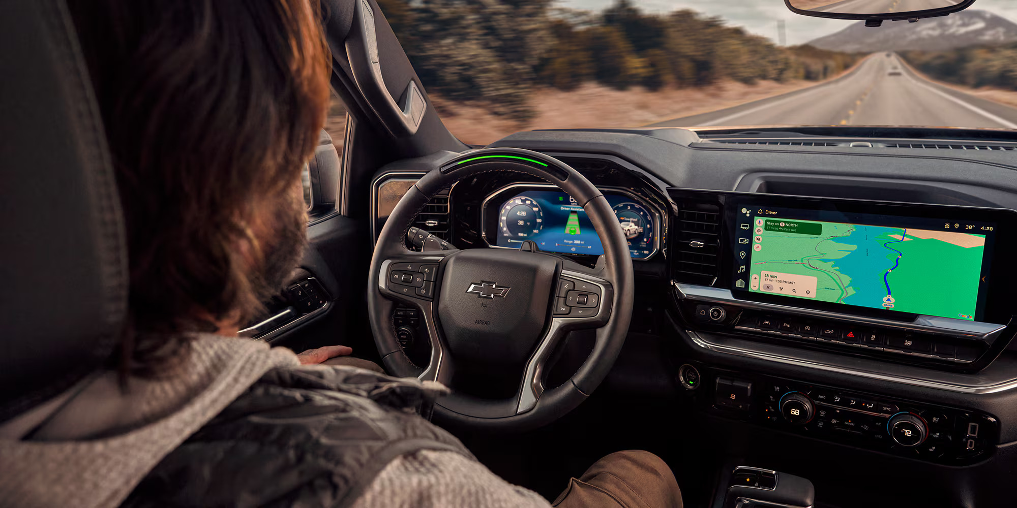 Interior of the 2026 Chevrolet Silverado 1500 with a driver behind the wheel