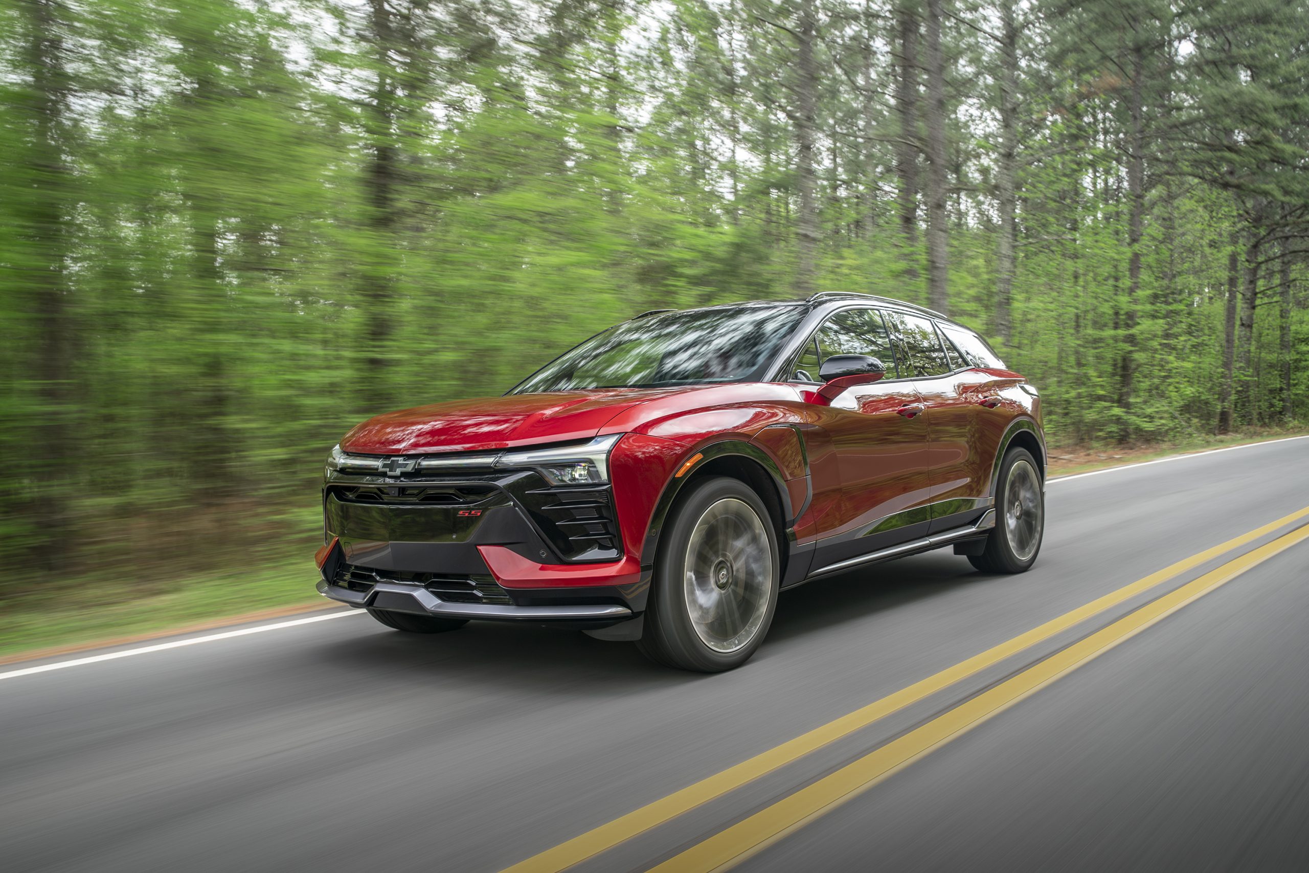 2026 Chevrolet Blazer EV driving through a forest