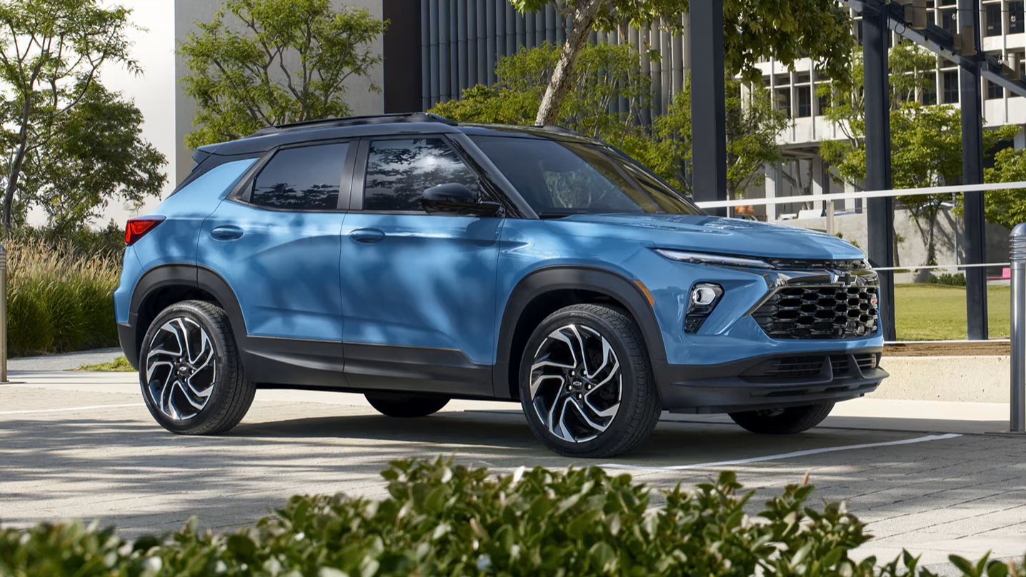 Blue 2026 Chevrolet Trailblazer parked on path in front of building